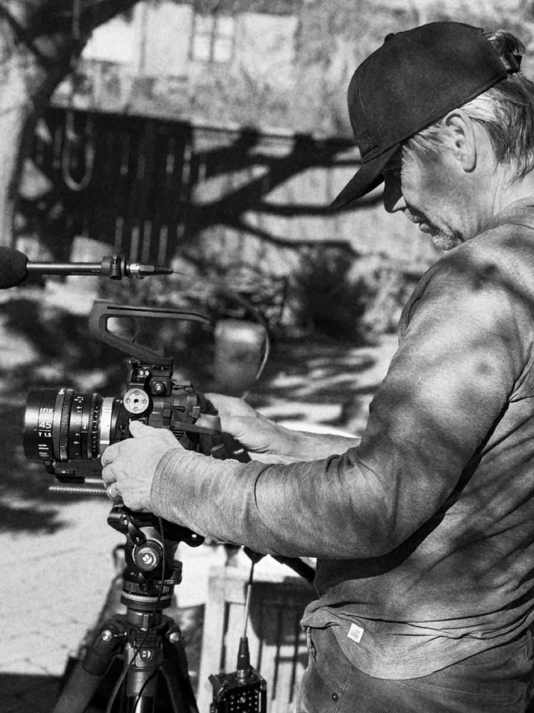 A filmmaker operating a cinema camera on location.
