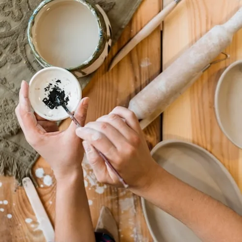 A potter at the wheel in their workshop